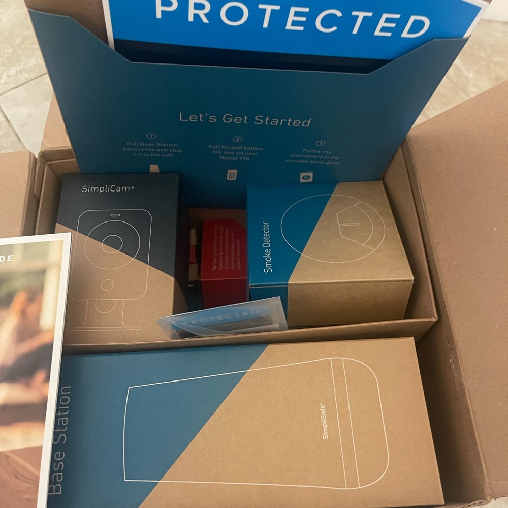 SimpliSafe Security Kit with Blue and Brown Packaging